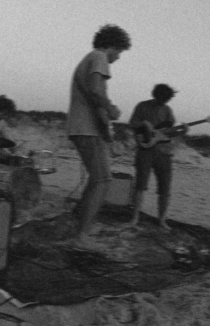 Artists working through a song outdoors